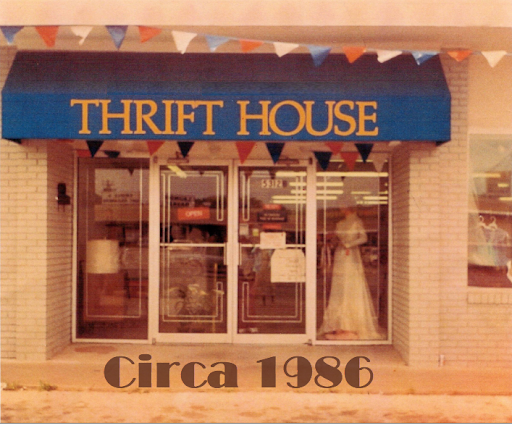 Front of the thrift store with a blue Thrift House awning and Circa 1986 text at the bottom.
